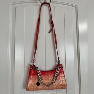 Stylish Red and Tan Crossbody Bag with Chain Detail